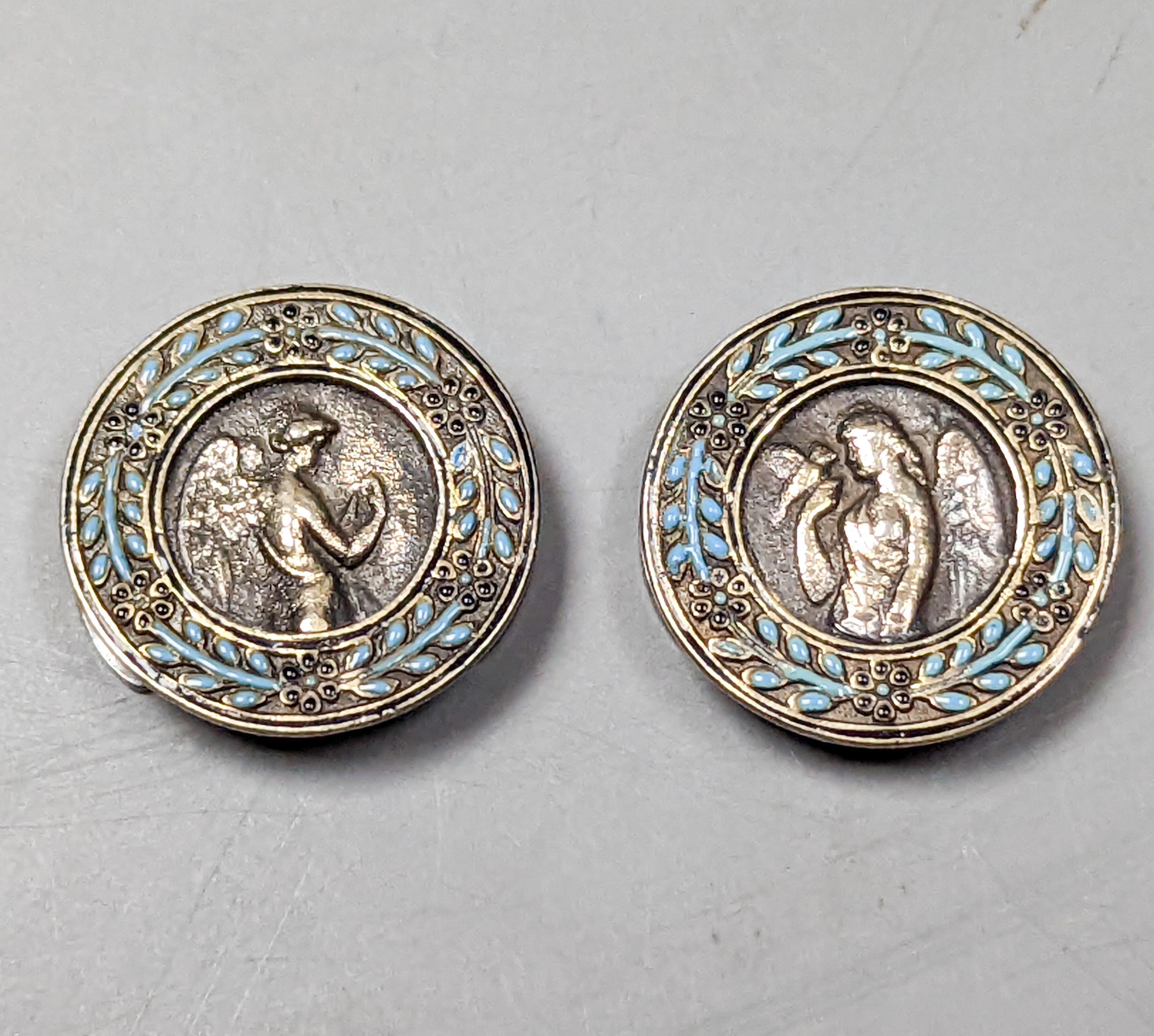 A pair of antique French white metal and enamel buttons, diameter 20mm.